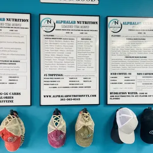 menus and hats hanging on a wall