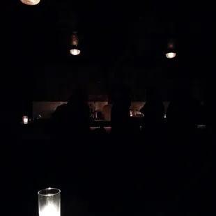 people in a dimly lit room