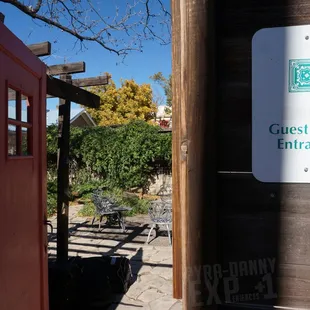 From the alley, you open the orange door and BAM!- Now you're in the courtyard where the rooms are.