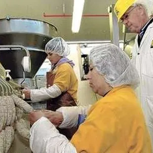 a group of people working in a factory