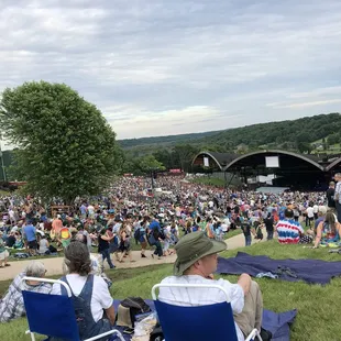 two people sitting in lawn chairs
