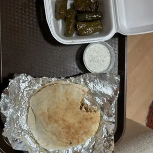 Chicken Shawarma Sandwich, dolmas, tahini sauce.