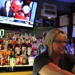 a woman sitting at a bar