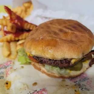 Char bacon cheeseburger with fries at Al&apos; Burgers on 8/29/24