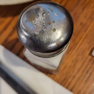 a salt and pepper shaker on a table