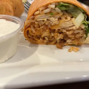 Buffalo Chicken wrap With rice inside a jalapeño cheese wrap