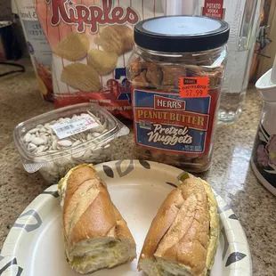 Scrambled egg with green peppers, onions, and cheese with some other treats - pumpkin seeds and Herr&apos;s pretzels and chips