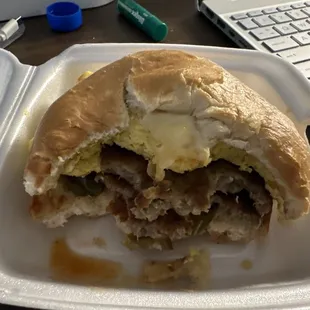 Breakfast sandwich being enjoyed