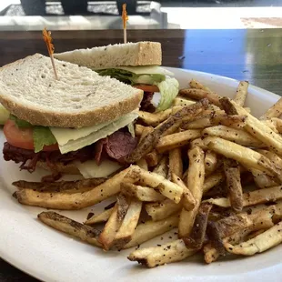 a plate of fries and a sandwich