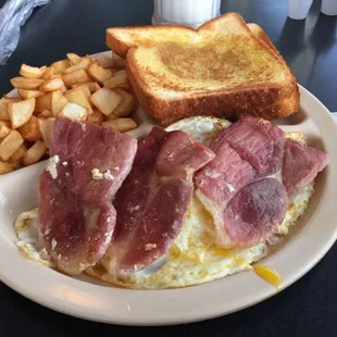 Country ham, eggs, hash browns, buttered toast.