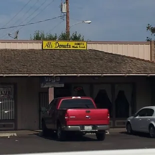 a red truck parked in front of a building