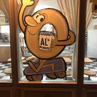 a cartoon character holding a donut