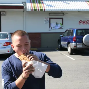 a man eating a hot dog