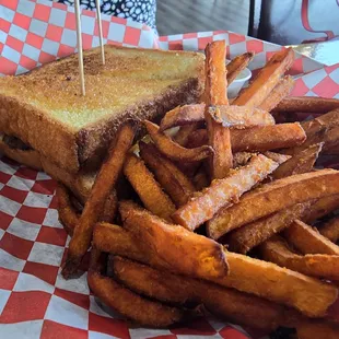 Patty-melt with sweet potato fries.