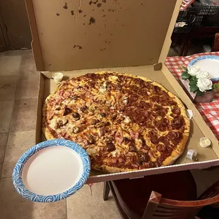 King Kong sized pizza. Paper plate for scale. This pizza is approx the size of 3+ regular XL pizzas.