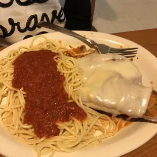 a plate of spaghetti and meat