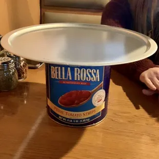 a person holding a pizza pan
