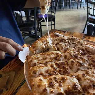 a man eating a slice of pizza
