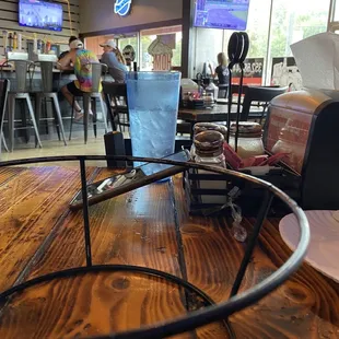 a wooden table with a phone on it