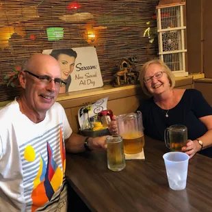 a man and a woman sitting at a table