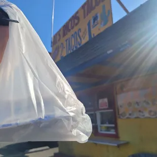 a person holding a plastic bag