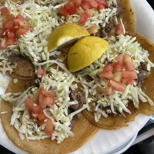 Asada tacos with everything (comes with cabbage and tomato on top - lemon and salsa on the side)