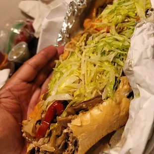 I took a couple of bites out of these cheese steak and it was so good...11 more inches of steak to go!
