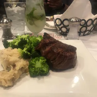 10 ounce filet with broccoli and mashed potatoes. With there in house mojito in the background. Very fresh mojito and very flavorful.