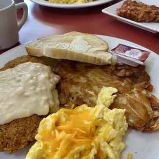 Pancake delight and the chicken fried steak with scrambled eggs ( added cheese), and side of corned beef hash