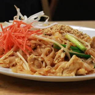 PAD THAI  THAI STYLE PAD THAI WITH EGG BEAN SPROUTS SCALLIONS AND TOPPED WITH GROUND CHILI