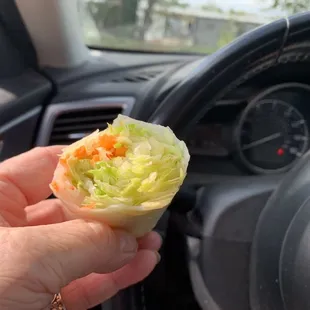 Salad roll eating in car.