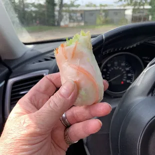 a hand holding a roll