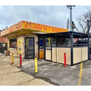 Outside Al&apos;s under the &quot;L&quot;. 2908 W Lake St, Chicago, IL HotDogs Polish Burgers Beef Chicken Turkey ..NO PORK! Cool!