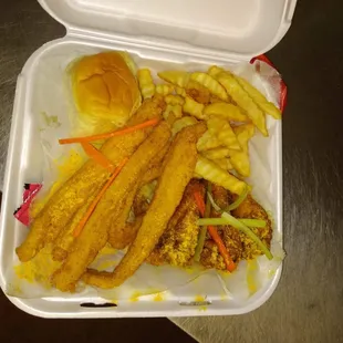 Six strips of catfish three wings and seasoned fries top with a roll and a cup of rich