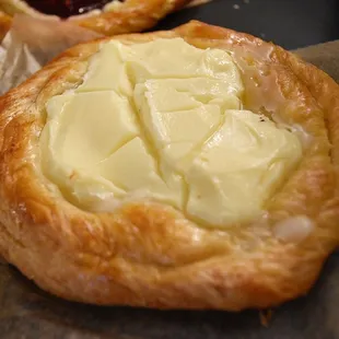 a pastry with butter and jam