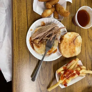 Sliced pork, hushpuppies and fries with bbq sauce. Unlike anything I have ever experienced. I would not recommend.