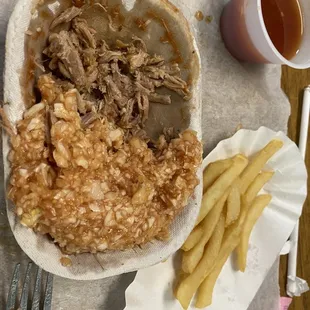 This is a tray of bbq pork with Red slaw. What in the world?  Must be an acquired taste. All I can say is, bless their hearts.