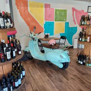 a scooter in a wine shop