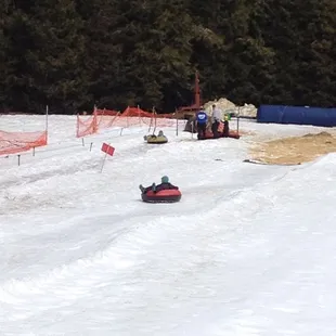 Notice how you don't have to hike back up to the top pulling your tube... you sit on your tube and get pulled back up!