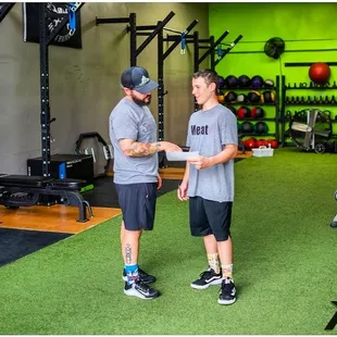 Coach Vinny leading an athlete through his custom program.