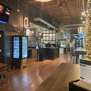 Looking toward kitchen and back seating area