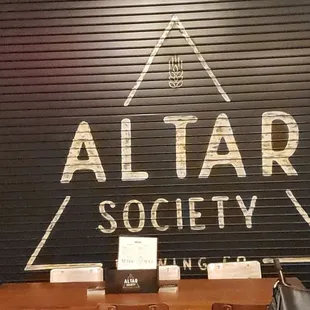 a wooden table with two glasses of beer