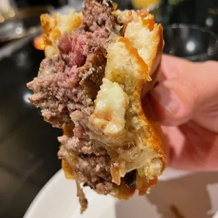 LE CHEESEBURGER saint andre, garlic aioli, cognac grilled onions, 'chips' $22