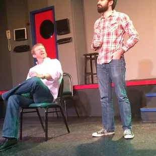 a man and a woman on stage