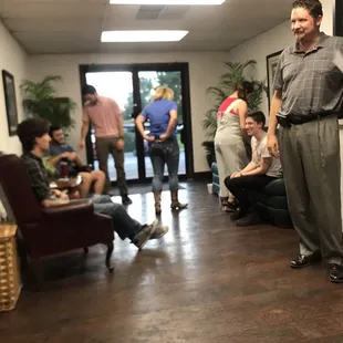 a man standing in a waiting room