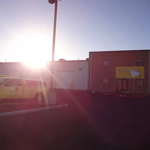 a yellow truck parked in a parking lot
