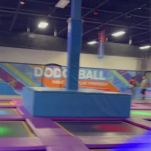 Soft podium that the kids can jump off of onto the trampolines.