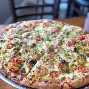 a pizza on a cake stand