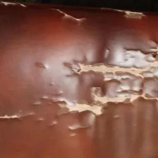 peeling paint on a leather table
