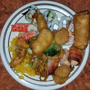 Plate with several of the buffet's options.